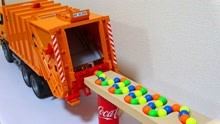 儿童积木玩具，弹珠在可乐罐大理石赛道溜进橙色垃圾车，声音舒缓